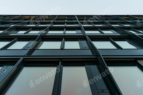 Preview: Low Angle View On Black Metal Structure And Framework For Building Under Overcast Sky