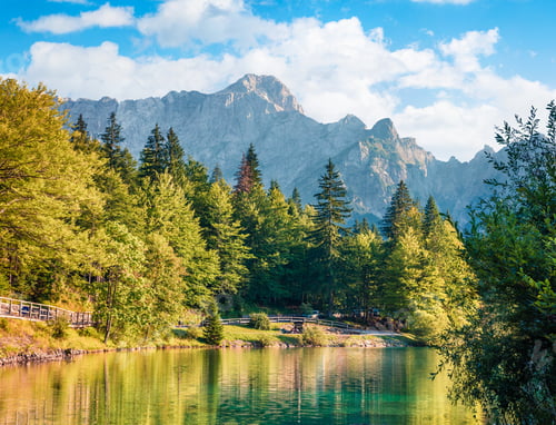 Preview: Sunny Morning View Of Fusine Lake. Colorful Summer Scene Of Julian Alps With Mangart Peak On