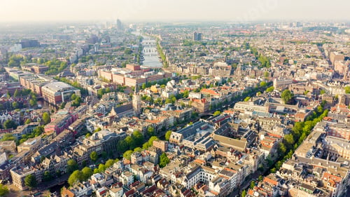 Preview: Amsterdam, Netherlands. Flying Over The City Rooftops. The Historical Part Of The City With Urban