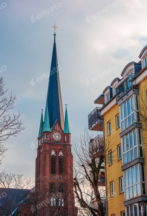 Preview: Old Church Tower Next To An Apartment House