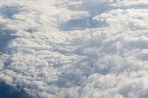 Preview: Airplane Illuminator View On Fluffy Clouds And Blue Sky. Aerial View Background.
