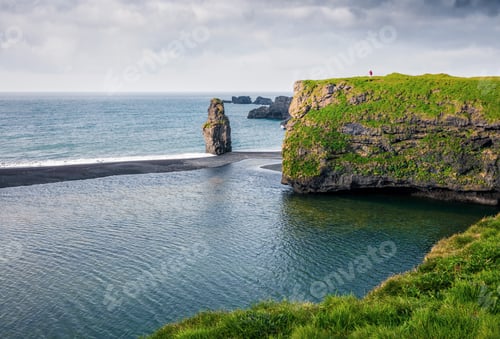 Preview: Picturesque Summer Sunrise In Dyrholaey Nature Reserve With Lonely Man On The Rock. Great View Of