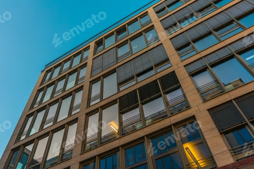 Preview: Low Angle Exterior View On Apartment Or Condominium Building With Various Window Guards
