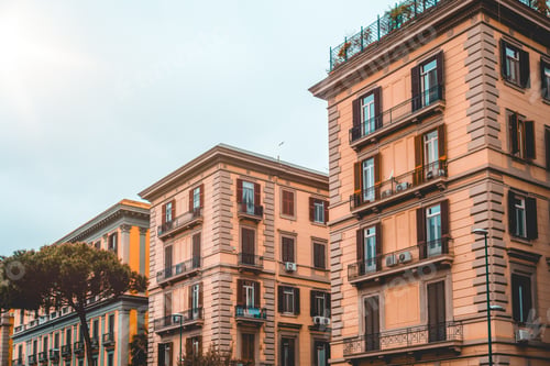 Preview: Two Apartment Buildings With Pine Tree On The Left