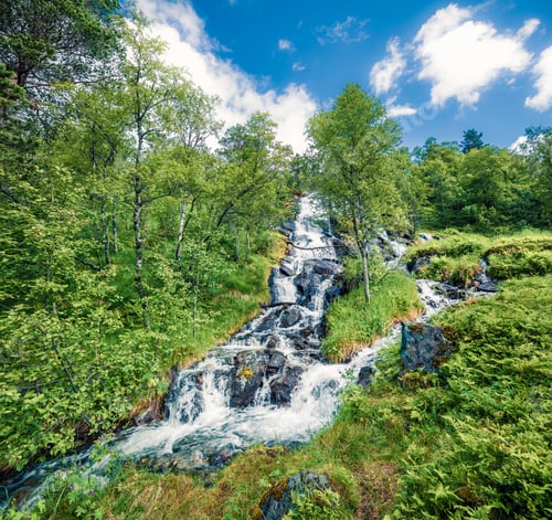 Preview: Sunny Summer View Of Small Waterfall Near Innerdalsvatna Lake. Colorful Morning Scene Of Norway