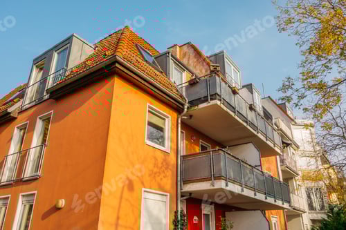 Preview: Orange Apartment Building With Autumn Tree