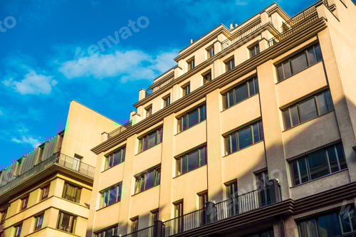 Preview: Yellow Colored Building In The Afternoon Sun