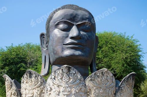 Preview: Head Of The Black Buddha In The Lotus Flower Closeup. Ancient Sculpture In The Buddhist Temple Of