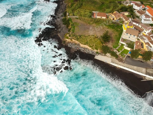Preview: Aerial Top View Of Sea Waves Hitting A Beach With Black Volcanic Sand With Turquoise Sea Water