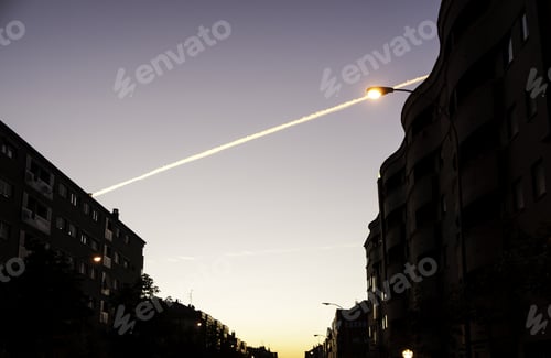 Preview: Nightfall In City With Lampposts, Construction And Landscape