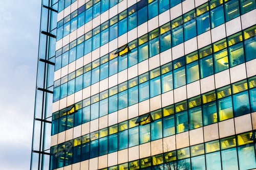Preview: High Contrasted Glass Facade Of Finance Building With Yellow Lights Inside