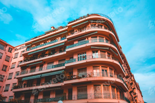 Preview: Red Colored Corner House With Curved Balcony