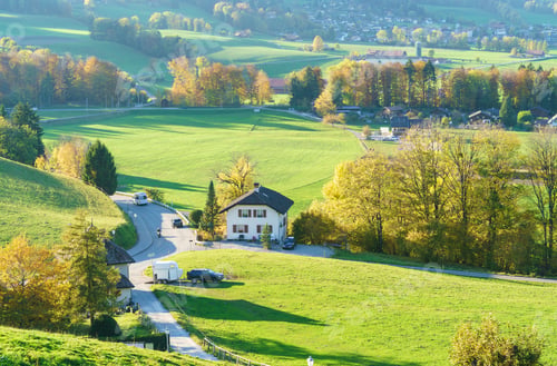 Preview: Aerial View Of A Beautiful Landscape With Traditional Houses, Green Meadows, Hills And Cows Near