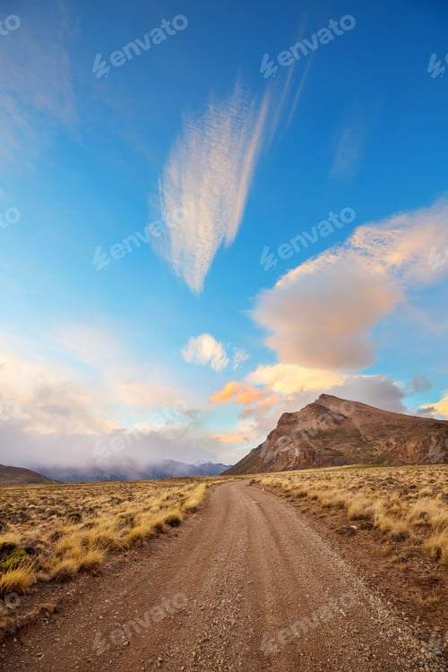 Preview: Patagonia Landscapes In Southern Argentina. Gravel Road In Prairie At Sunset.