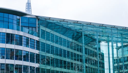 Preview: Architectural Close Up Of Modern Low Rise Office Building With Transparent Glass Facade On Overcast