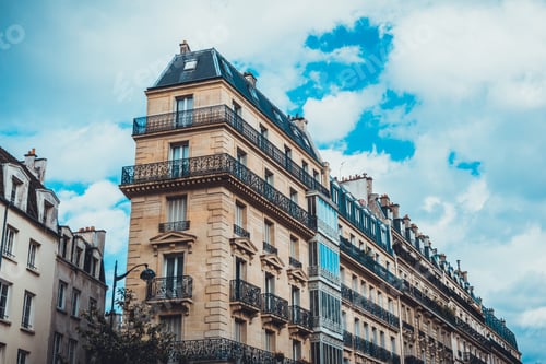 Preview: Low Angle View On Tall Historic Residential Apartment Buildings Under Scattered Cloudy Sky