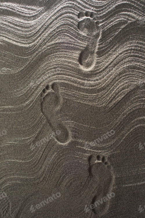 Preview: Set Of Footprints Printed On The Sand In Summer
