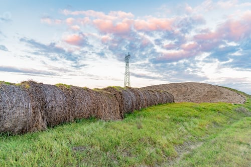 Preview: Electrical Pylon With Hay Bales At Sunset In The Tuscan Hills