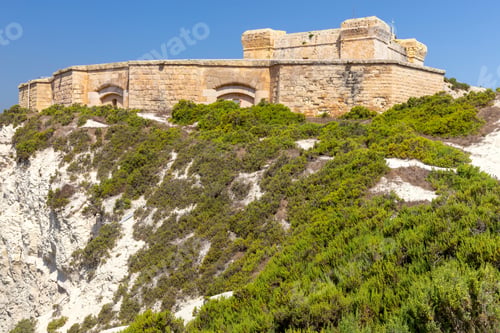 Preview: The Ancient Stone Tower Of St. Lucian And The Fort Over The Bay. Marsaxlokk. Malta.