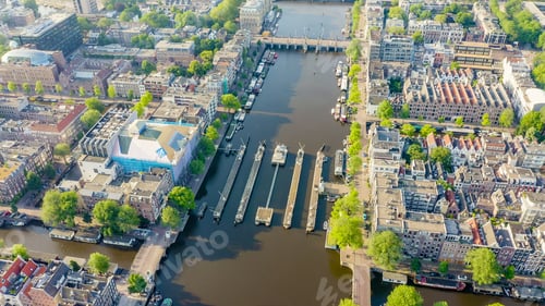 Preview: Amsterdam, Netherlands. Flying Over The City Rooftops. Amstel River, Amstel Gateways, Aerial View