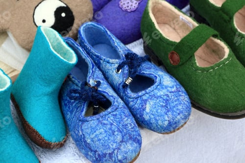 Preview: Various Felt Shoes On The Counter In Market