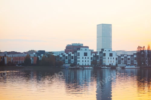 Preview: Spree River In The Evening With Townhouses And Skyscraper In The Background At Berlin, Germany