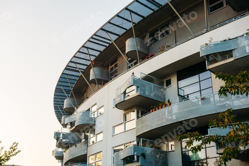 Preview: Futuristic Facade Of Apartment Complex With Curved Balcony