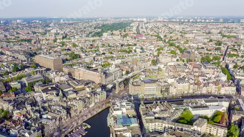 Preview: Amsterdam, Netherlands. Flying Over The City Rooftops. The Historical Part Of The City With Urban