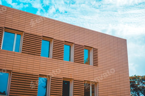 Preview: Orange Office Building With Modern Facade And Blue Windows