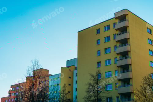 Preview: Yellow And Red Plattenbau Building With Copy Space On The Left Side