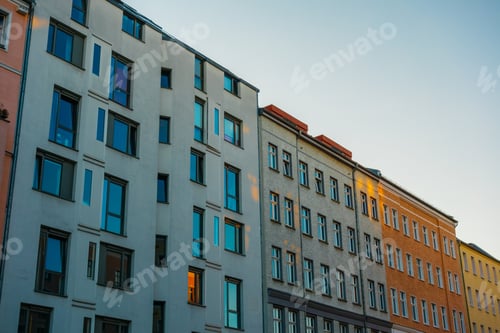 Preview: White And Orange Buildings In A Row In The Eve