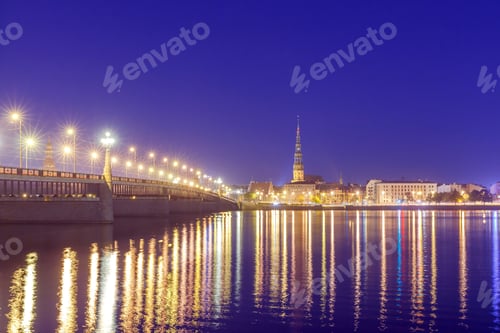 Preview: Evening View On The Embankment Of The Daugava River And The Spiers Of Churches In Riga.