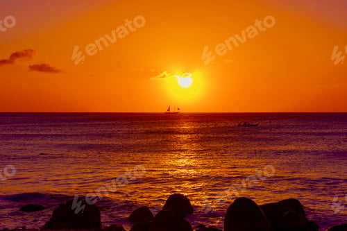 Preview: Bright And Colorful Sunset On The Caribbean Beach In Aruba Island In Winter With People On The