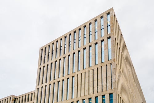 Preview: Modern Facade Of Finance House With Cloudy Sky