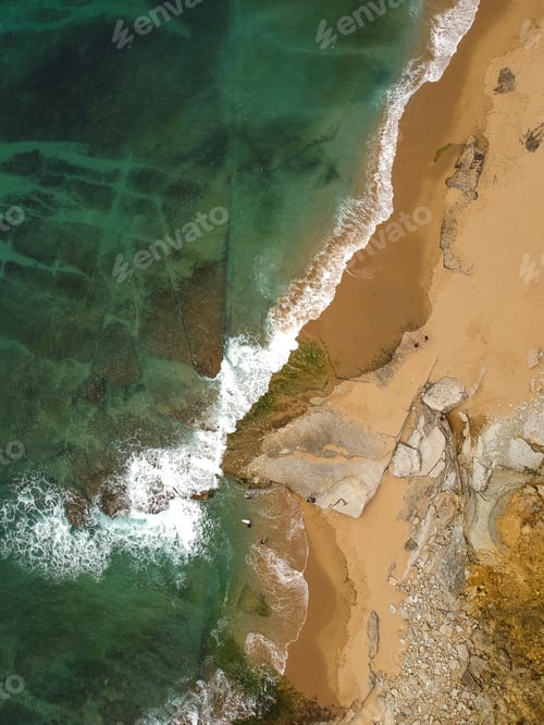 Preview: Surfer On The Beach Top View. Drone Shot On A Beach In A Summer Day.
