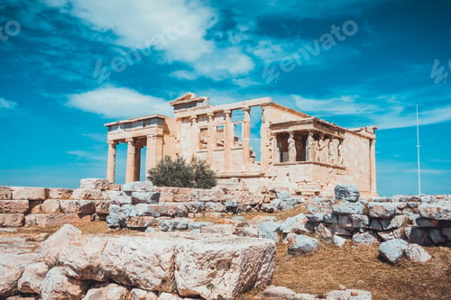 Preview: Scenic View Of Classical Greek Ruins Crumbling With Large Stones Scattered Around The Area