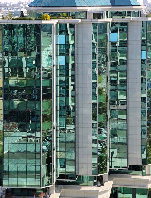 Preview: Modern Office Building With Green Glass Facade