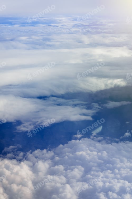 Preview: Airplane Illuminator View On Fluffy Cumulus Clouds And Blue Sky. Aerial View Background.