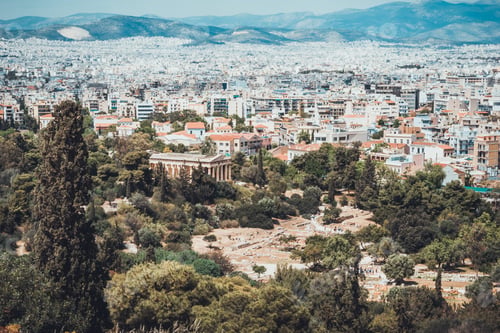Preview: Birds Eye View Of Ancient Archaeological Sites Surrounded By Green Trees And Modern Buildings In