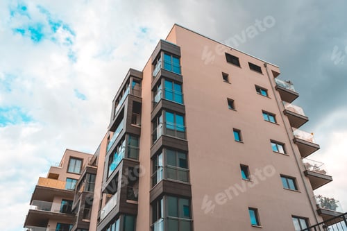 Preview: Orange Colored Apartment House With Glass Balcony