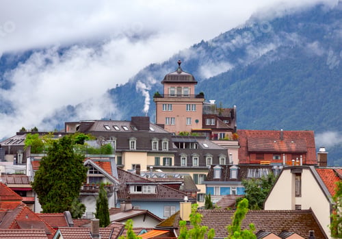 Preview: Scenic View Of The City Rooftops Of The Mountain On A Cloudy Day. Interlaken. Switzerland.