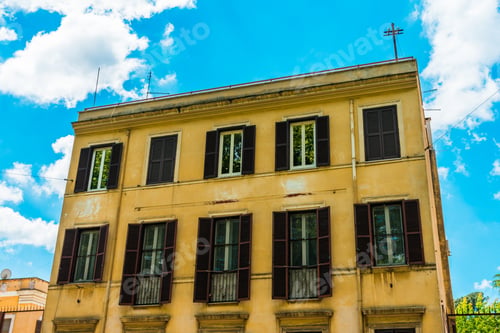 Preview: Old And Big Apartment House With Yellow Facade