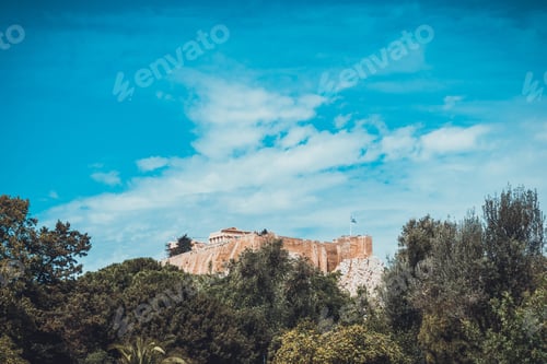 Preview: Old Greek Ruins In Background Trees In Foreground With Wide Blue Sky And Copy Space Above