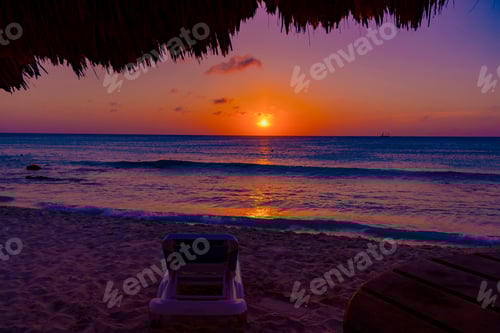 Preview: Bright And Colorful Sunset On The Caribbean Beach In Aruba Island In Winter With People On The