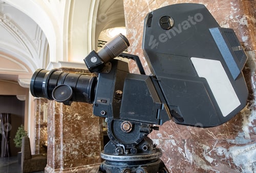 Preview: Vintage Movie Camera. An Old Movie Camera Stands On A Wooden Tripod.