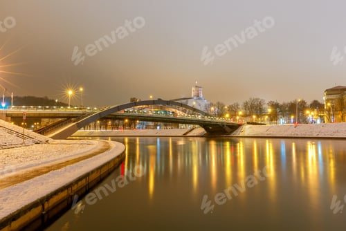 Preview: Iron Arched Mindaugas Bridge Across Neris River In Vilnius With Night Lighting. Lithuania.