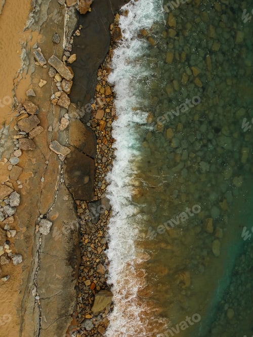 Preview: Aerial View Of Sandy Beach With Waves And Clear Ocean Water. Drone Photo