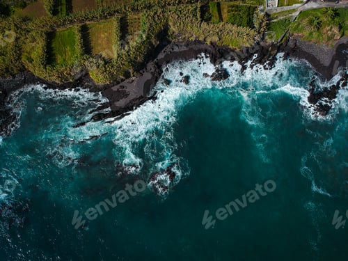 Preview: Aerial Top View Of Sea Waves Hitting A Beach With Black Volcanic Sand With Turquoise Sea Water