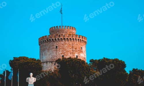 Preview: Beautiful White Tower With Trees, Statue And Flags