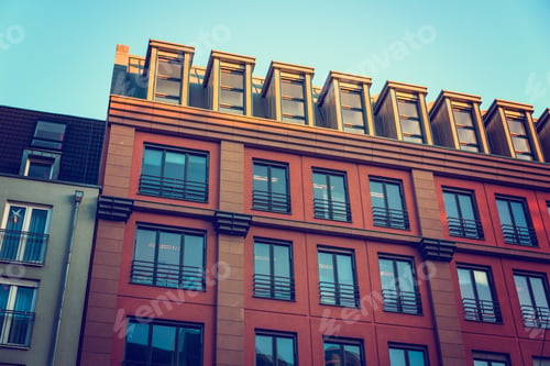 Preview: Red Facaded Building With Big Blue Windows
